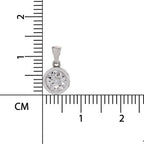 A silver-toned round bezel pendant with a clear gemstone, shown next to a centimeter ruler for scale on a white background.
