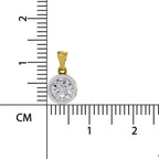 A round bezel-set pendant with a yellow gold bail and a clear round gemstone in a silver-toned setting, shown next to a centimeter ruler for scale on a white background.