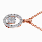 A rose gold pendant necklace featuring a double halo design with a central round-cut clear gemstone surrounded by a halo of smaller clear stones, on a clean white background.