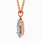 Rose gold oval pendant necklace with a halo of small clear stones and a central marquise-cut clear stone, shown on a white background.