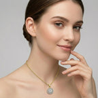 Woman wearing a rose gold necklace with a diamond pendant on a neutral background