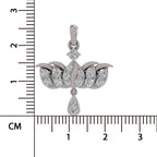 A silver pendant with pavé-set clear stones, featuring a teardrop-shaped drop and a small diamond accent, shown next to a centimeter ruler for scale on a white background.