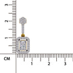 A rectangular diamond pendant with a gold and diamond halo, shown next to a centimeter ruler for scale on a white background.