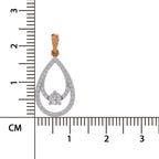 A teardrop-shaped pendant in rose gold with a pavé diamond setting and a central round-cut diamond, shown next to a black ruler with centimeter markings to indicate its size.