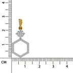 A gold and silver pendant with a round clear gemstone and a hexagonal pavé design, shown next to a centimeter ruler for scale on a white background.
