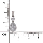 A silver teardrop-shaped pendant with a small heart-shaped cluster of clear stones above a larger teardrop cluster, shown next to a black ruler with centimeter markings on a white background.