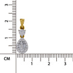 A gold and diamond pendant displayed next to a centimeter ruler to show its size. The pendant features a teardrop-shaped diamond cluster with a smaller round diamond cluster above it, attached to a gold bail.