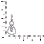A silver pendant with a clear central gemstone and pavé-set stones, shown next to a centimeter ruler for scale on a white background.