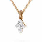 A rose gold diamond pendant necklace featuring a four-stone diamond cluster pendant on a delicate chain, set against a clean white background.