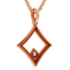 Rose gold geometric diamond-shaped pendant necklace with a small clear round gemstone, shown on a white background.