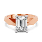 Emerald cut lab grown diamond solitaire ring in rose gold with white gold prongs and a faceted band