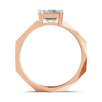A faceted rose gold ring with a single round-cut diamond set in a high-profile octagonal band, shown against a plain white background.