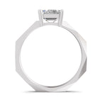 A white gold or platinum solitaire ring with a single round-cut gemstone in a prong setting, shown from a top-down perspective on a white background.