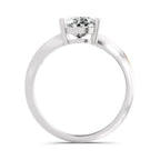 Round brilliant-cut diamond solitaire ring featuring a polished white gold band with a four-prong setting, shown from the side against a white background.


