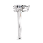 Side view of a round brilliant-cut diamond ring featuring a polished white gold band and a four-prong setting, displayed on a white background.


