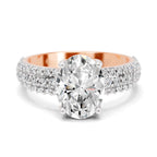 Angled view of a rose gold oval-cut 2.00 ct diamond engagement ring with a pavé diamond band