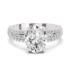 Top view of a white gold oval-cut 2.00 ct diamond engagement ring with a pavé diamond band