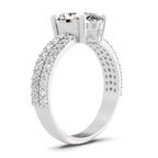 Angled view of a white gold oval-cut 2.00 ct diamond engagement ring with a pavé diamond band