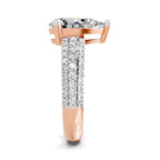 Side view of a rose gold pear-cut 2.00 ct diamond engagement ring with a pavé diamond band