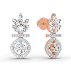 Rose gold and silver earrings on a white background