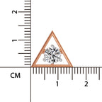 Triangular diamond ring with a ruler for scale on a white background